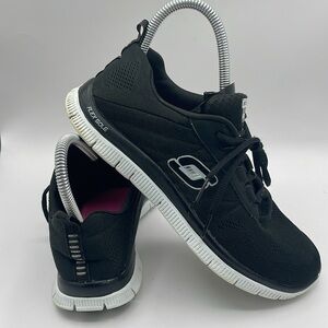 Skechers Women's Size 9 Black and White Sneakers with Modern Design